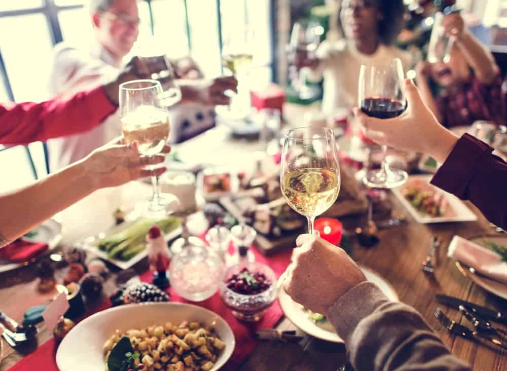 Image of Family Together Celebrating Christmas with Food and Wine