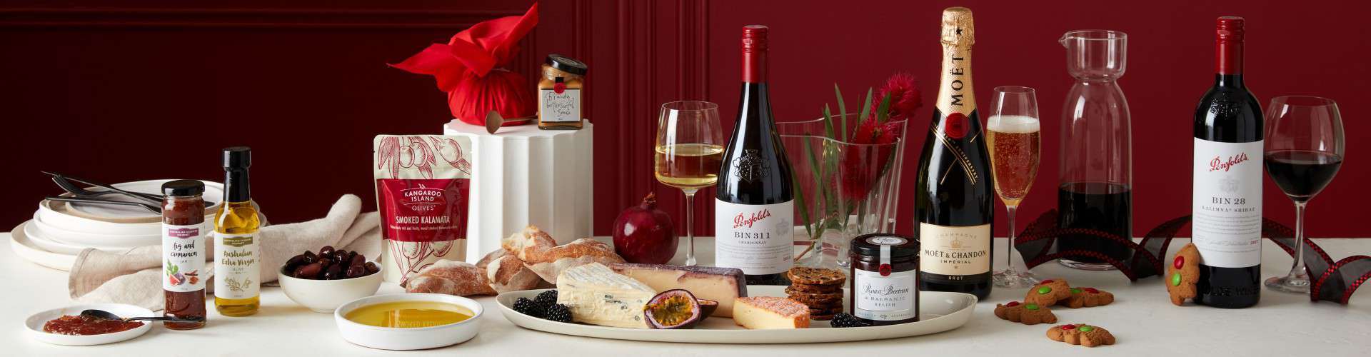 Displaying the Christmas Pudding, Wine and Gourmet Food contained in our Christmas hampers.